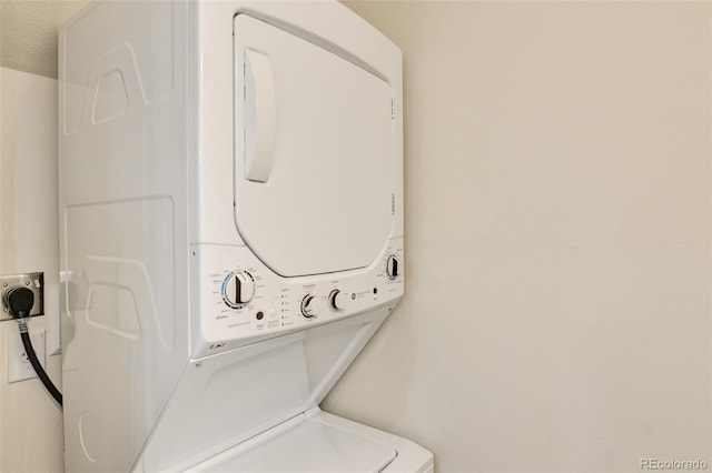 304 Barnwood Dr, Buena Vista, CO 81211 - laundry room featuring stacked washing machine and dryer