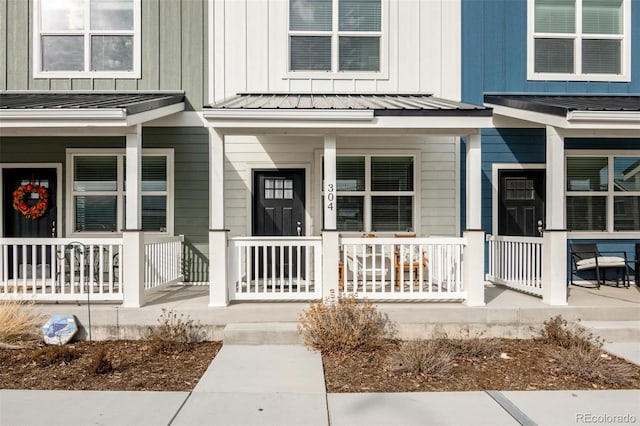 304 Barnwood Dr, Buena Vista, CO 81211 - view of exterior entry featuring covered porch, board and batten siding, a standing seam roof, and a metal roof