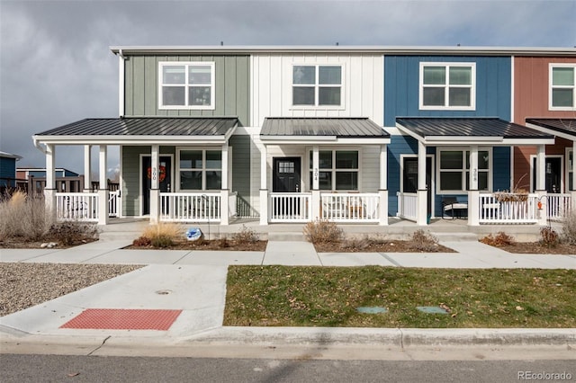 304 Barnwood Dr, Buena Vista, CO 81211 - townhome / multi-family property featuring covered porch, a standing seam roof, and board and batten siding