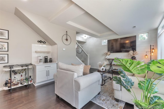 18096 E 104th Way, Commerce City, CO 80022 - living area featuring stairway, dark wood-style floors, and wood walls
