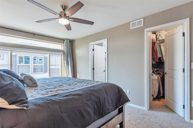 18096 E 104th Way, Commerce City, CO 80022 - bedroom featuring light colored carpet, a spacious closet, a closet, and ceiling fan
