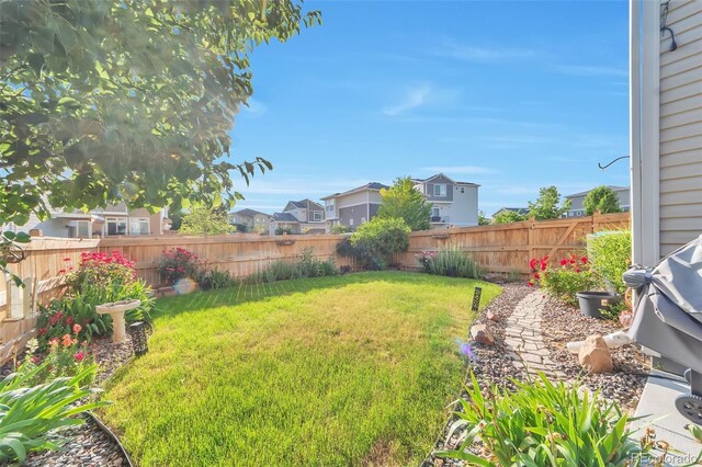 18096 E 104th Way, Commerce City, CO 80022 - fenced backyard featuring a residential view