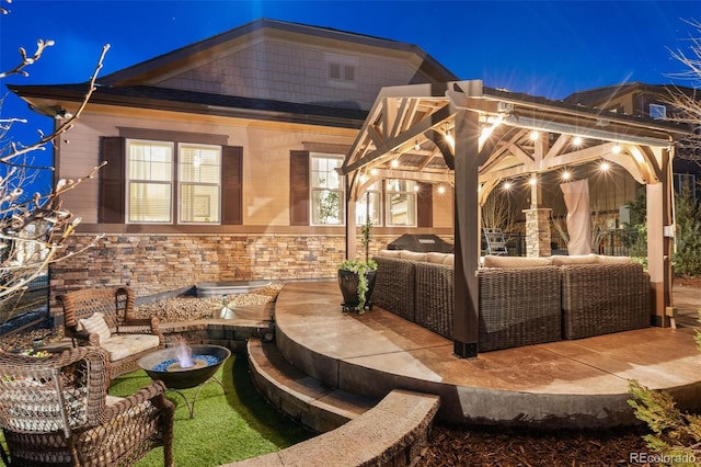 7743 S Quantock Way, Aurora, CO 80016 - patio at twilight featuring an outdoor living space and a patio