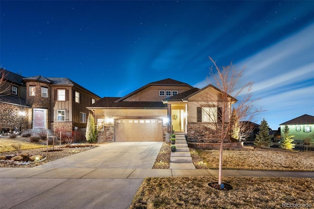 7743 S Quantock Way, Aurora, CO 80016 - craftsman-style home with a garage, driveway, stone siding, and board and batten siding