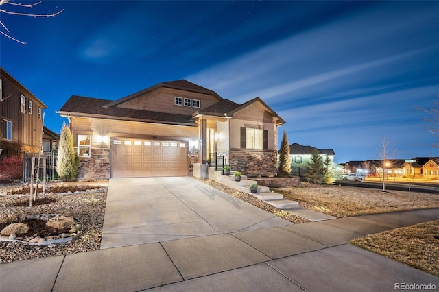 7743 S Quantock Way, Aurora, CO 80016 - craftsman-style home with stone siding, concrete driveway, and a garage