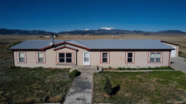 4486 Lariat Rd, Monte Vista, CO 81144 - view of front of house with a mountain view and metal roof