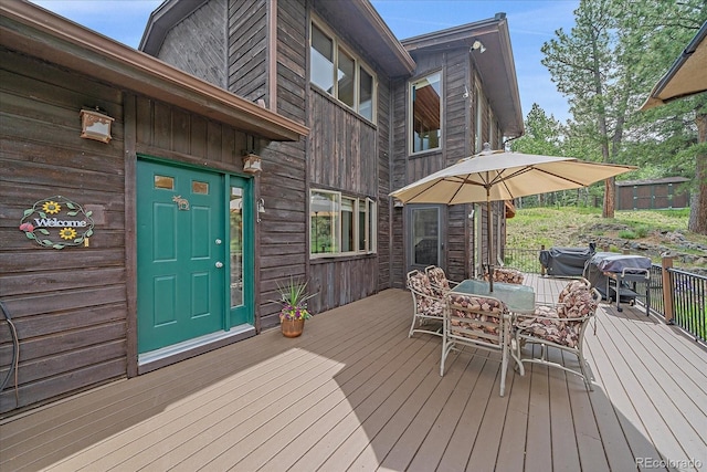 9745 Hilldale Dr, Morrison, CO 80465 - wooden terrace with outdoor dining area