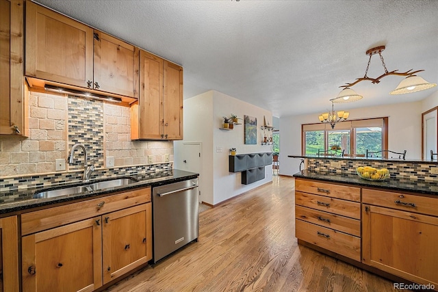 9745 Hilldale Dr, Morrison, CO 80465 - kitchen with dishwasher, decorative backsplash, a chandelier, light wood-type flooring, and pendant lighting