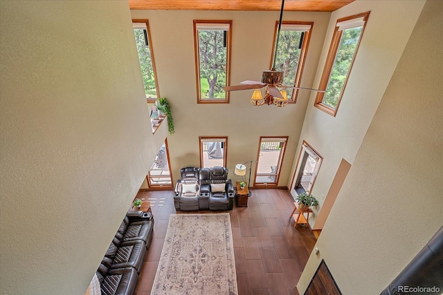 9745 Hilldale Dr, Morrison, CO 80465 - living room featuring ceiling fan, wood finished floors, and a textured wall