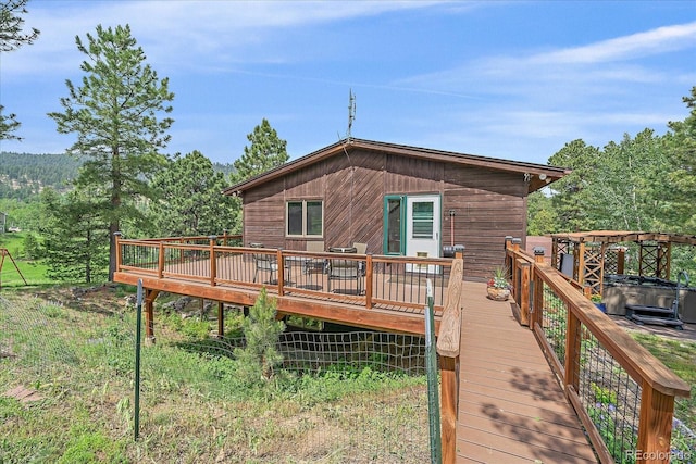 9745 Hilldale Dr, Morrison, CO 80465 - rear view of house featuring a deck and a wooded view