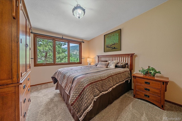 9745 Hilldale Dr, Morrison, CO 80465 - bedroom with light carpet and a textured ceiling