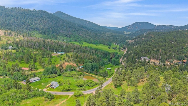 9745 Hilldale Dr, Morrison, CO 80465 - aerial view of property and surrounding area with a forest and mountains