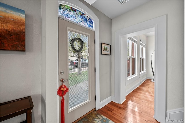 1717 E 22nd Ave, Denver, CO 80205 - entryway featuring baseboards and hardwood / wood-style flooring
