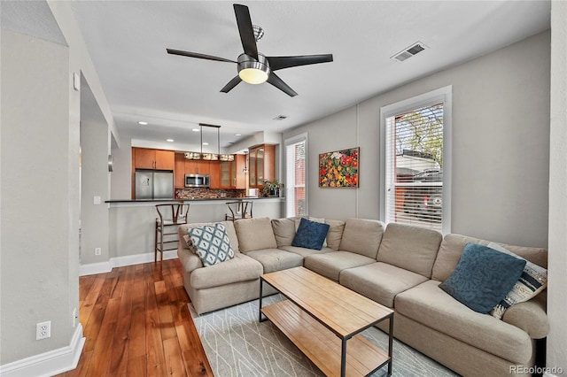 1717 E 22nd Ave, Denver, CO 80205 - living area featuring a ceiling fan, baseboards, recessed lighting, visible vents, and hardwood / wood-style flooring
