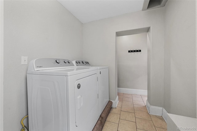 1717 E 22nd Ave, Denver, CO 80205 - laundry area featuring light tile patterned floors, baseboards, laundry area, and washer and clothes dryer
