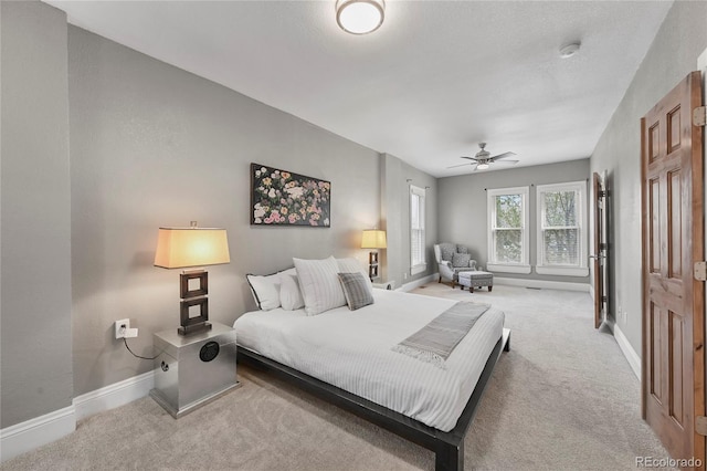 1717 E 22nd Ave, Denver, CO 80205 - bedroom featuring baseboards and light carpet