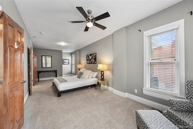 1717 E 22nd Ave, Denver, CO 80205 - carpeted bedroom with baseboards and ceiling fan