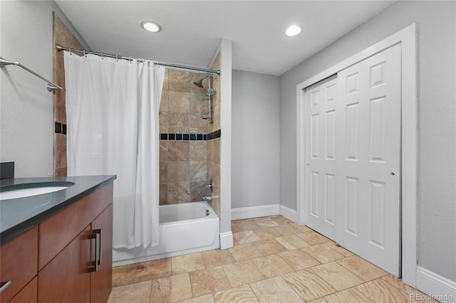 1717 E 22nd Ave, Denver, CO 80205 - full bath featuring stone tile flooring, vanity, baseboards, shower / bathtub combination with curtain, and recessed lighting