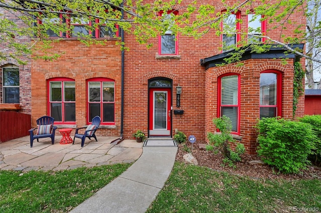 1717 E 22nd Ave, Denver, CO 80205 - view of front of house with brick siding and a patio area