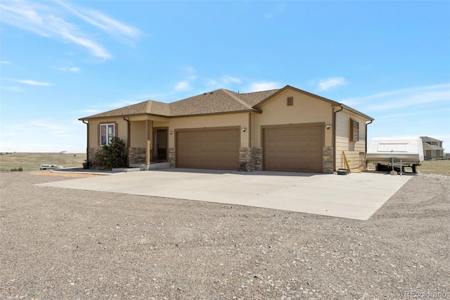 3560 Zane Gray Loop, Parker, CO 80138 - view of front of home with concrete driveway, a garage, and stone siding