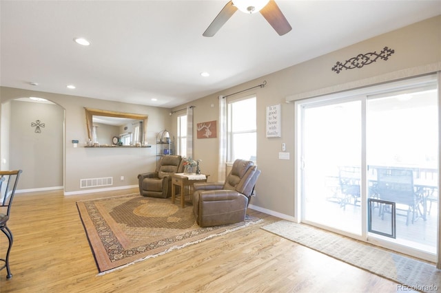 3560 Zane Gray Loop, Parker, CO 80138 - living room with ceiling fan, wood finished floors, arched walkways, and recessed lighting