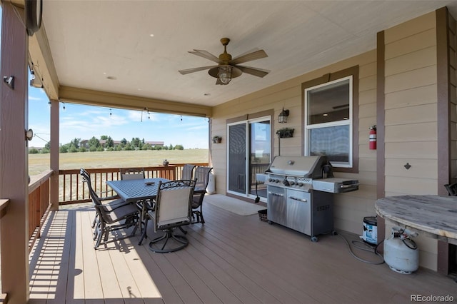 3560 Zane Gray Loop, Parker, CO 80138 - wooden deck featuring outdoor dining area, area for grilling, and a ceiling fan