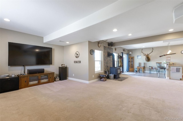 3560 Zane Gray Loop, Parker, CO 80138 - living area featuring carpet, a wood stove, and recessed lighting