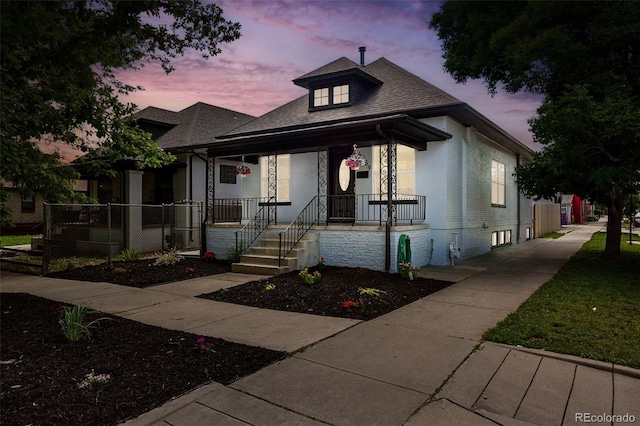 4059 Quivas St, Denver, CO 80211 - bungalow-style house featuring a porch and a shingled roof