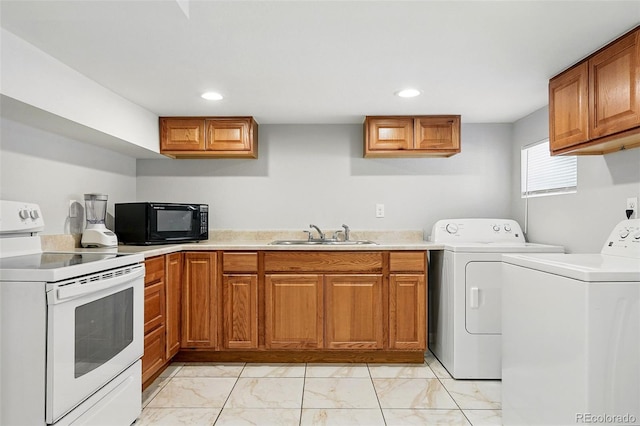4059 Quivas St, Denver, CO 80211 - laundry room featuring washing machine and clothes dryer, light marble finish flooring, and recessed lighting