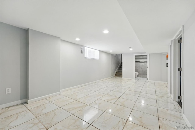 4059 Quivas St, Denver, CO 80211 - basement featuring light marble finish flooring, stairway, and recessed lighting
