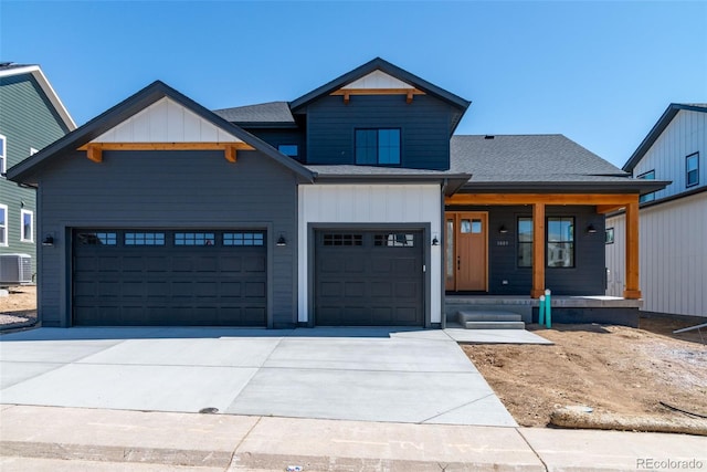 view of front facade with central AC, a porch, concrete driveway, a shingled roof, and board and batten siding