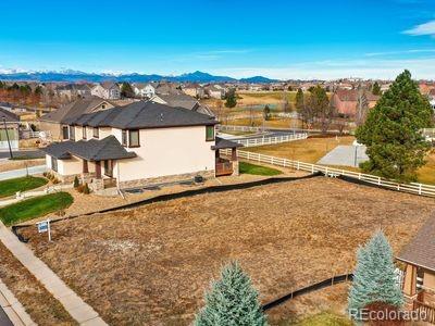 view of side of property featuring fence and a mountain view