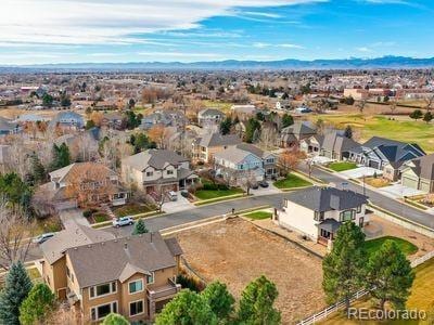 drone / aerial view featuring a mountain view and a residential view