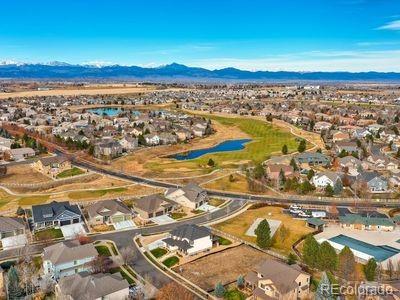 aerial view featuring a residential view and a water and mountain view