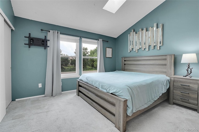 9615 W Chatfield Ave Unit C, Littleton, CO 80128 - carpeted bedroom with a skylight and vaulted ceiling