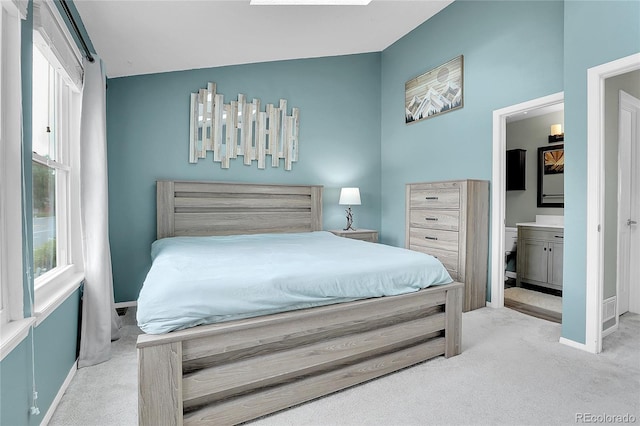 9615 W Chatfield Ave Unit C, Littleton, CO 80128 - carpeted bedroom with ensuite bathroom and baseboards