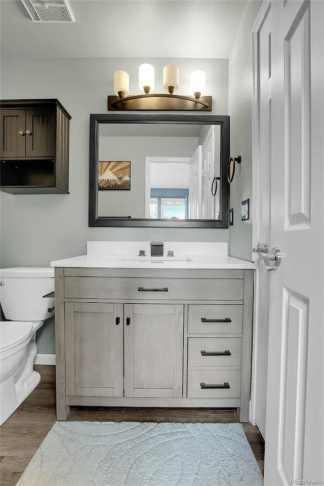 9615 W Chatfield Ave Unit C, Littleton, CO 80128 - bathroom with vanity and wood finished floors