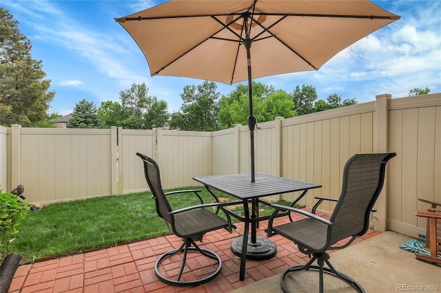 9615 W Chatfield Ave Unit C, Littleton, CO 80128 - fenced backyard with a patio area and outdoor dining area