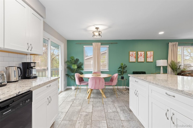 8506 Eaton St, Arvada, CO 80003 - kitchen featuring dishwasher, baseboards, white cabinetry, recessed lighting, and backsplash