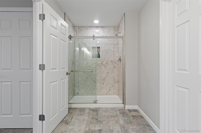 8506 Eaton St, Arvada, CO 80003 - bathroom with a marble finish shower and baseboards