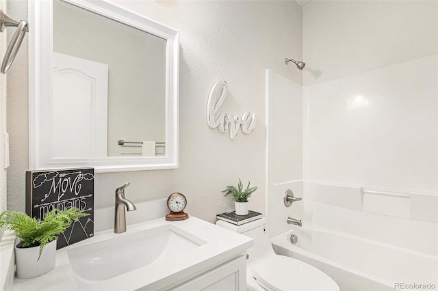 full bathroom featuring shower / bathing tub combination, vanity, and toilet