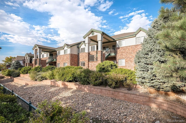 view of property exterior with a balcony