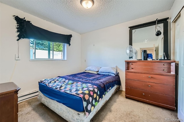 2241 Dexter Dr Unit 3, Longmont, CO 80501 - carpeted bedroom featuring baseboard heating and a textured ceiling
