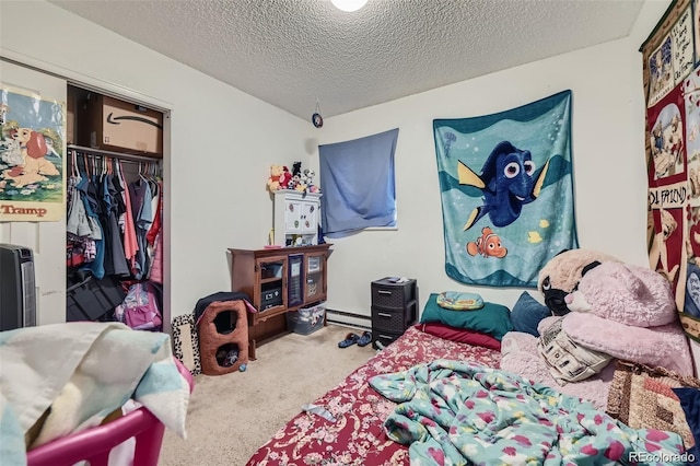 2241 Dexter Dr Unit 3, Longmont, CO 80501 - bedroom featuring carpet, a textured ceiling, a closet, and baseboard heating