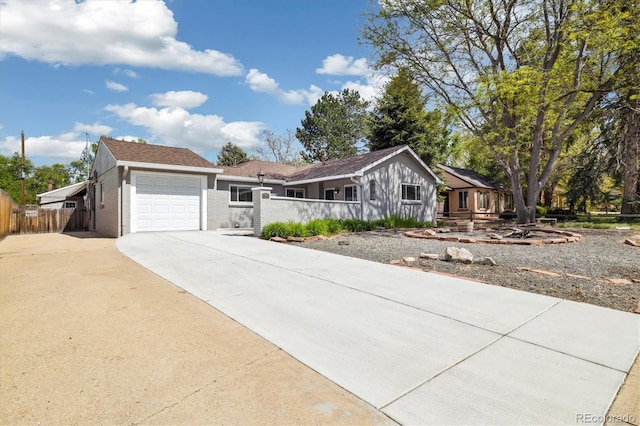 4500 Zephyr St, Wheat Ridge, CO 80033 - ranch-style home featuring driveway, fence, and a garage