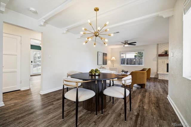 4500 Zephyr St, Wheat Ridge, CO 80033 - dining area featuring beam ceiling, dark wood-style floors, ceiling fan, a brick fireplace, and a chandelier