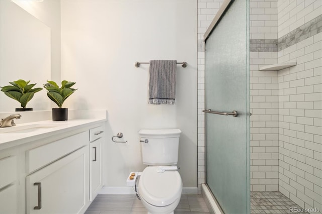 4500 Zephyr St, Wheat Ridge, CO 80033 - full bath featuring a shower stall, vanity, toilet, and baseboards