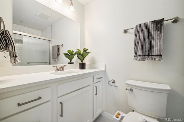 4500 Zephyr St, Wheat Ridge, CO 80033 - full bath with toilet, tiled shower, vanity, and baseboards