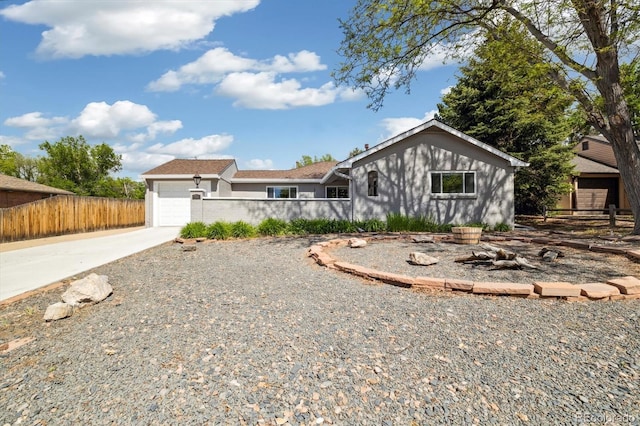 4500 Zephyr St, Wheat Ridge, CO 80033 - single story home featuring fence, a garage, driveway, and stucco siding