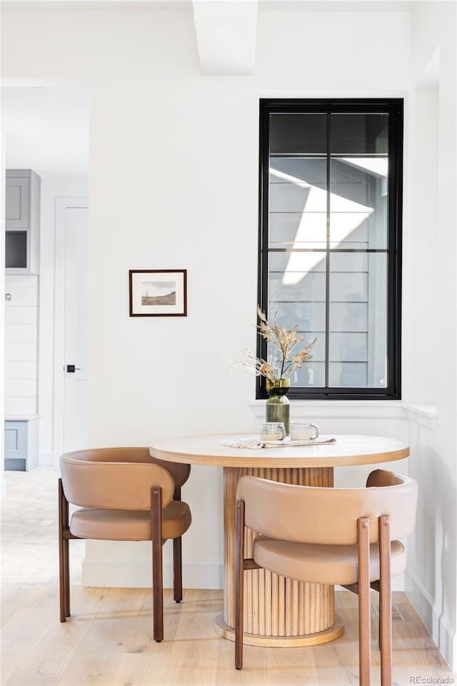 1680 S Humboldt St, Denver, CO 80210 - dining room featuring baseboards and light wood-type flooring